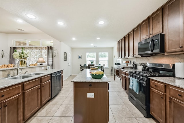4223 Leafy Bough Ct, Humble, TX 77346 - kitchen with gas stove, a sink, a kitchen island, dishwasher, and tasteful backsplash