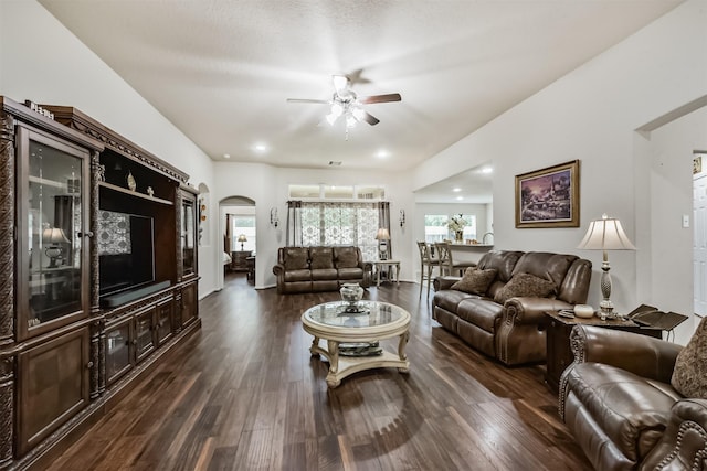 4223 Leafy Bough Ct, Humble, TX 77346 - living room featuring arched walkways, a ceiling fan, and dark wood finished floors
