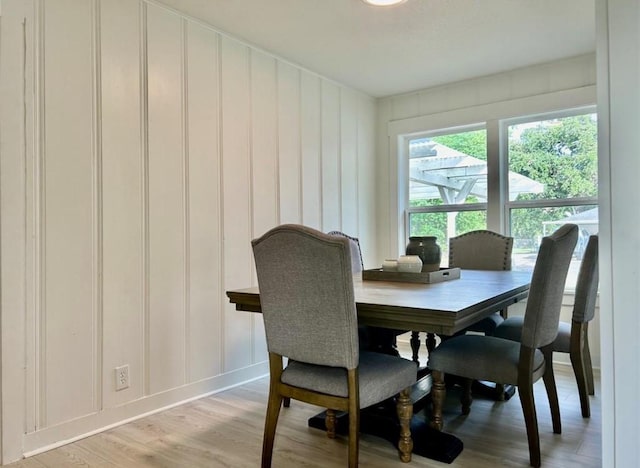 319 Wisteria St, Lake Jackson, TX 77566 - dining room with light wood-type flooring and a decorative wall