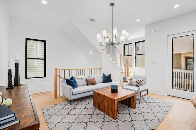 515 E 4th St, Houston, TX 77007 - living area featuring wood finished floors, a chandelier, recessed lighting, baseboards, and stairs