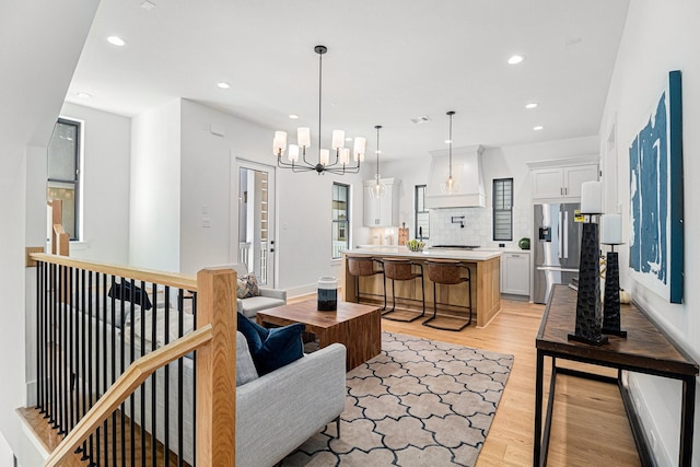 515 E 4th St, Houston, TX 77007 - living area featuring light wood-style floors, recessed lighting, and a chandelier