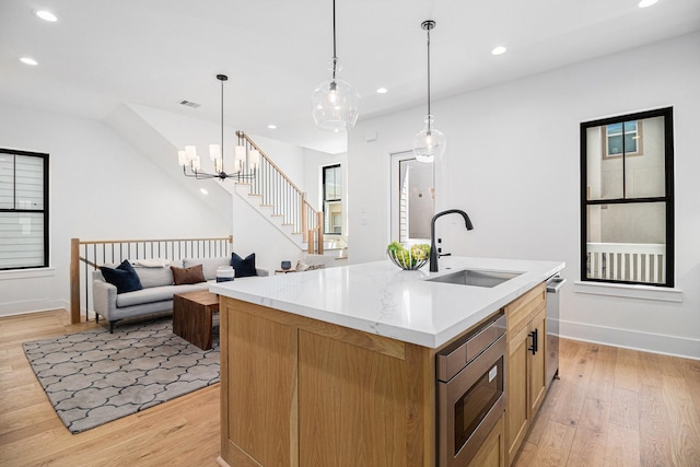 515 E 4th St, Houston, TX 77007 - kitchen featuring stainless steel appliances, a sink, light wood-style flooring, recessed lighting, and baseboards