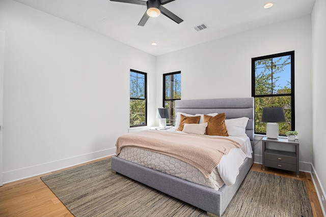 515 E 4th St, Houston, TX 77007 - bedroom featuring wood finished floors, baseboards, recessed lighting, and ceiling fan