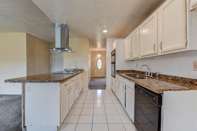4919 Prairie Ridge Rd, Houston, TX 77053 - kitchen with black appliances, a sink, range hood, a peninsula, and white cabinets