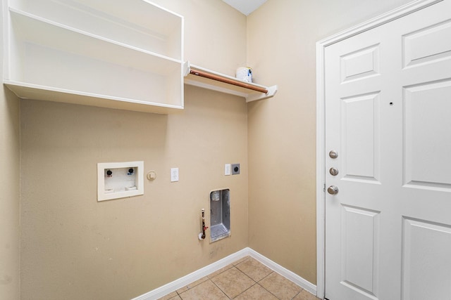 13707 Kingston River Ln, Houston, TX 77044 - laundry area with electric dryer hookup, gas dryer hookup, light tile patterned flooring, baseboards, and hookup for a washing machine