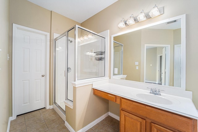 13707 Kingston River Ln, Houston, TX 77044 - full bath with tile patterned flooring, a shower stall, vanity, and baseboards