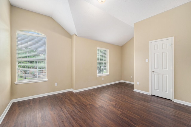 13707 Kingston River Ln, Houston, TX 77044 - unfurnished room featuring vaulted ceiling, dark wood-type flooring, and baseboards