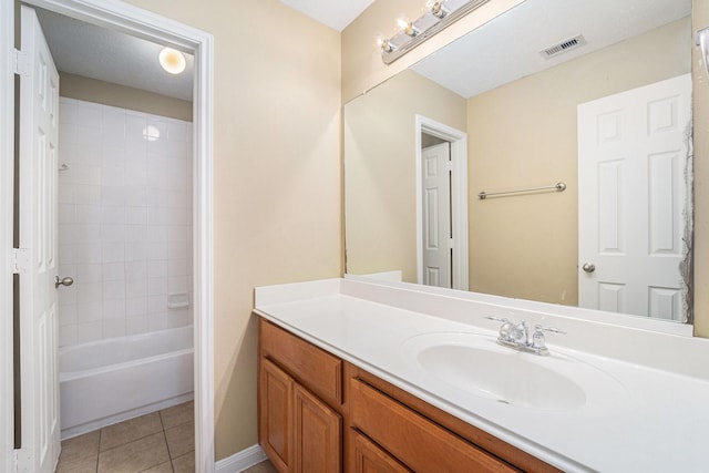 13707 Kingston River Ln, Houston, TX 77044 - bathroom featuring vanity, tile patterned floors, tub / shower combination, and baseboards