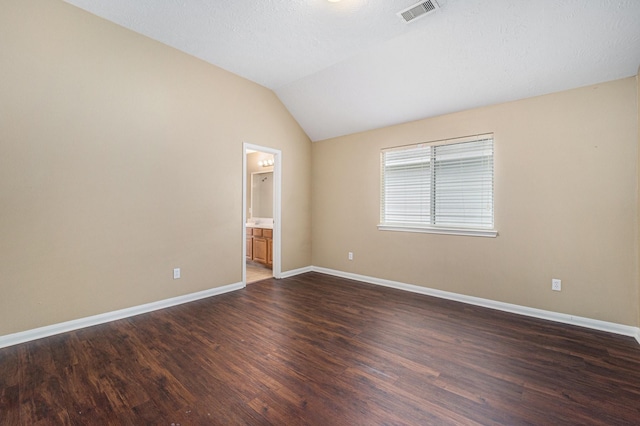13707 Kingston River Ln, Houston, TX 77044 - spare room with dark wood finished floors, lofted ceiling, and baseboards