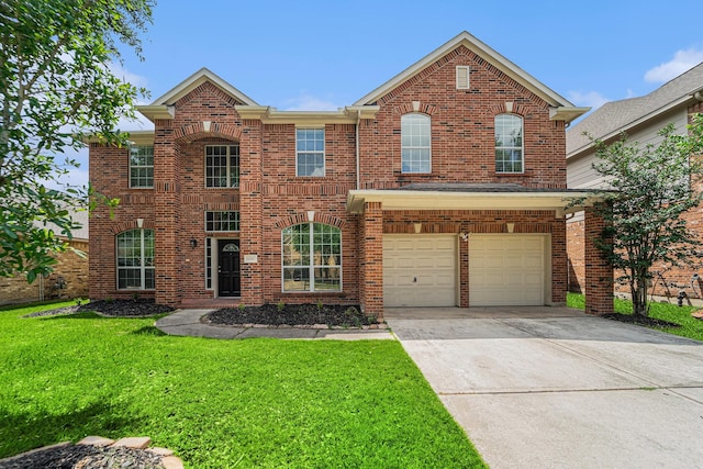 13707 Kingston River Ln, Houston, TX 77044 - view of front of home with a front lawn, concrete driveway, brick siding, and a garage