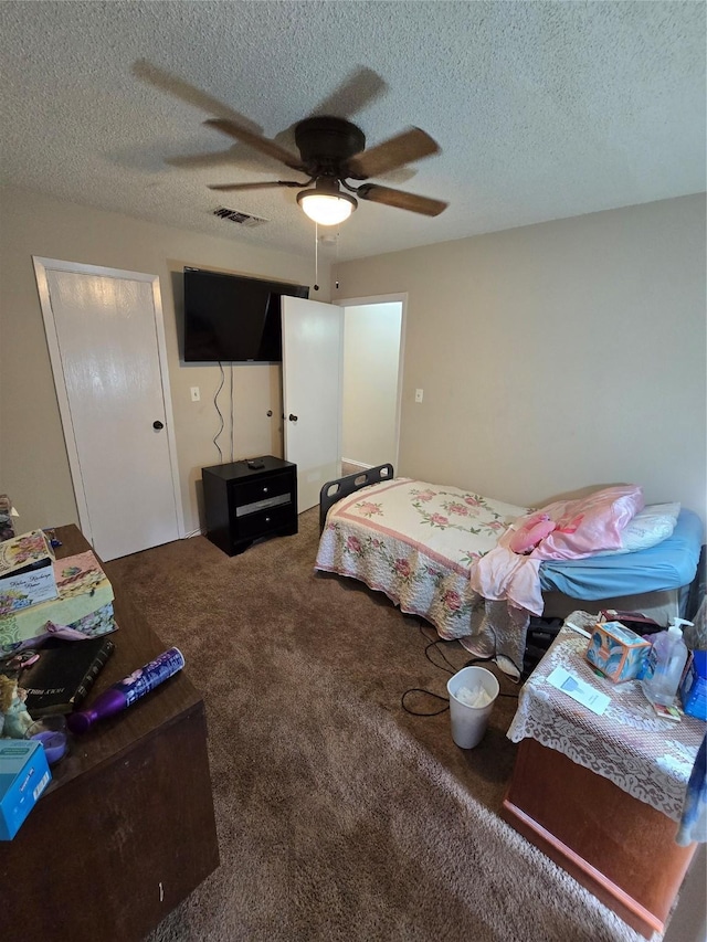2501 Gulf Fwy Unit 249D, Dickinson, TX 77539 - carpeted bedroom featuring a textured ceiling and ceiling fan