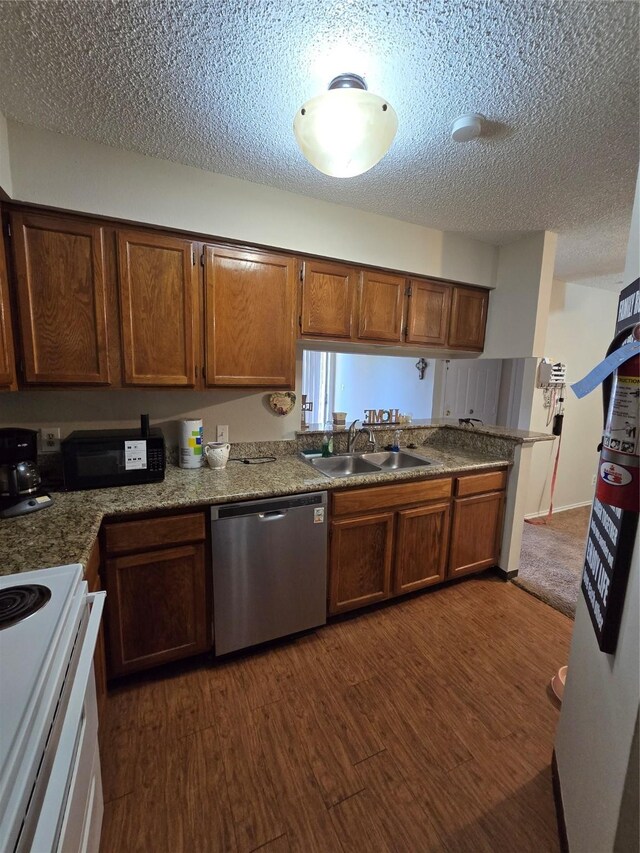 2501 Gulf Fwy Unit 249D, Dickinson, TX 77539 - kitchen featuring stainless steel dishwasher, white range with electric stovetop, dark wood-type flooring, a textured ceiling, and brown cabinetry
