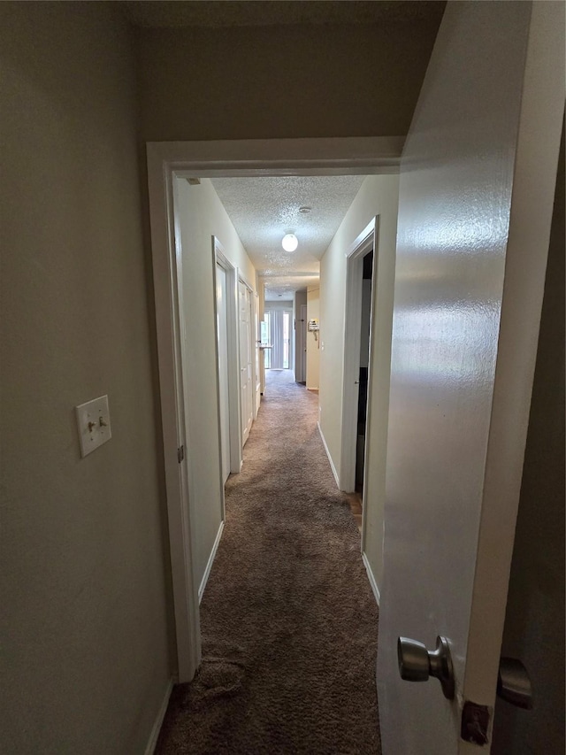 2501 Gulf Fwy Unit 249D, Dickinson, TX 77539 - hall with carpet flooring and a textured ceiling