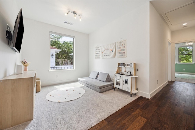406 Welch St, Houston, TX 77006 - living area featuring dark wood-style flooring, attic access, baseboards, and recessed lighting