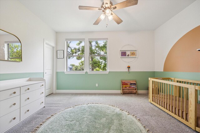 406 Welch St, Houston, TX 77006 - bedroom with a nursery area, carpet floors, baseboards, and a ceiling fan