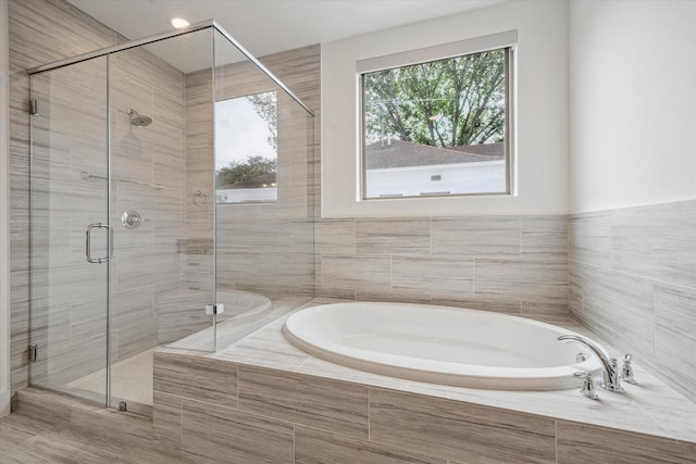 406 Welch St, Houston, TX 77006 - bathroom with a bath and a shower stall
