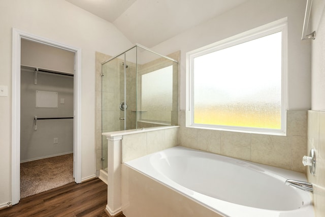 5323 Camerford Ct, Alvin, TX 77511 - full bathroom featuring a bath, a stall shower, a spacious closet, wood finished floors, and lofted ceiling