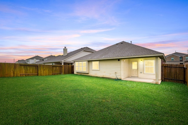 5323 Camerford Ct, Alvin, TX 77511 - back of house featuring a shingled roof and a patio area