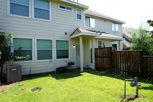 1608 Grable Cove Ln, Spring, TX 77379 - rear view of property with cooling unit and a shingled roof