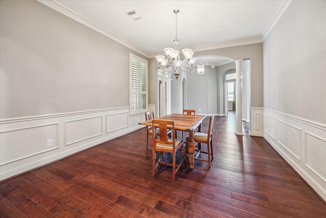 2703 Kestrel Trace Ln, Katy, TX 77494 - dining space with decorative columns, arched walkways, crown molding, hardwood / wood-style flooring, and a chandelier