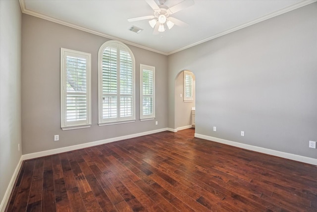 2703 Kestrel Trace Ln, Katy, TX 77494 - empty room featuring ceiling fan, dark wood finished floors, crown molding, baseboards, and arched walkways