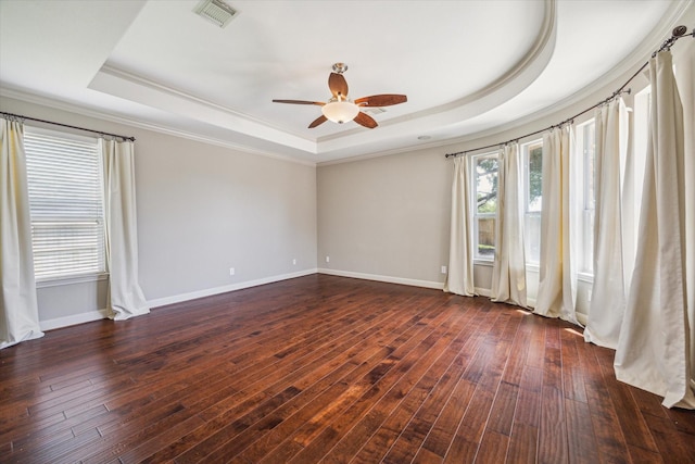 2703 Kestrel Trace Ln, Katy, TX 77494 - unfurnished room with a raised ceiling, ceiling fan, crown molding, dark wood-style flooring, and baseboards