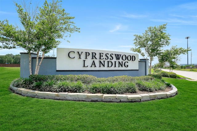23607 Buttress Root Dr, Spring, TX 77373 - community / neighborhood sign with a yard