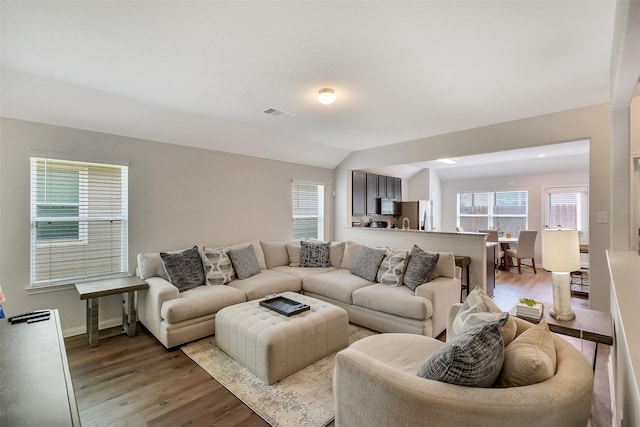 23607 Buttress Root Dr, Spring, TX 77373 - living area with light wood-type flooring, baseboards, and lofted ceiling