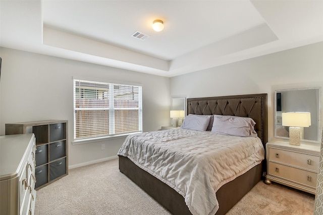 23607 Buttress Root Dr, Spring, TX 77373 - bedroom with a raised ceiling, light colored carpet, and baseboards