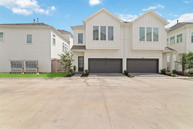 6307 Chelsea Falls Ln, Houston, TX 77008 - townhome / multi-family property featuring board and batten siding, a garage, and driveway