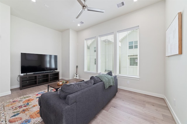 6307 Chelsea Falls Ln, Houston, TX 77008 - living room with light wood finished floors, a ceiling fan, baseboards, and recessed lighting