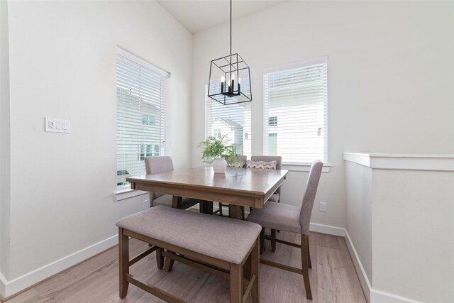 6307 Chelsea Falls Ln, Houston, TX 77008 - dining room with light wood-style floors, a chandelier, healthy amount of natural light, and baseboards