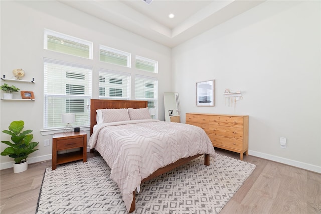 6307 Chelsea Falls Ln, Houston, TX 77008 - bedroom with light wood-type flooring, baseboards, a high ceiling, and recessed lighting