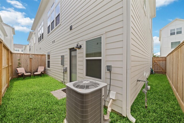 6307 Chelsea Falls Ln, Houston, TX 77008 - back of property with central AC