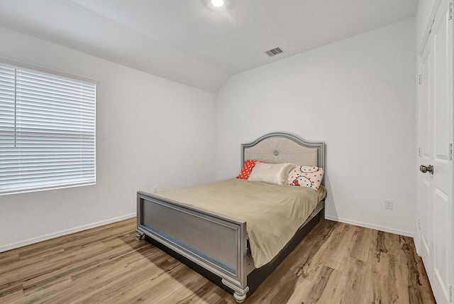 4818 Penton Meadow Ln, Rosharon, TX 77583 - bedroom featuring wood finished floors, baseboards, and lofted ceiling