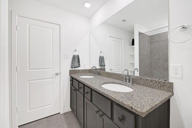 21746 Heather Elm Dr, Cypress, TX 77433 - full bathroom featuring double vanity and tile patterned floors