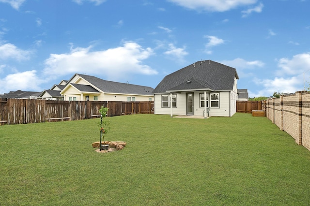21746 Heather Elm Dr, Cypress, TX 77433 - rear view of house featuring a shingled roof and a patio