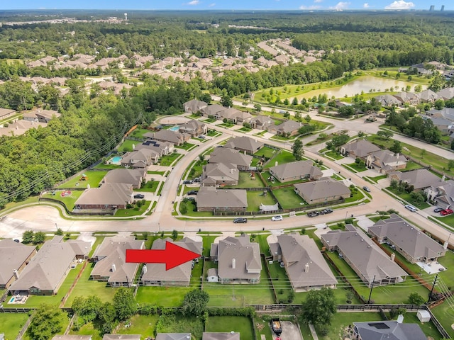 5015 Gold Lantana Trl, Spring, TX 77389 - aerial view of property's location featuring a forest, nearby suburban area, and a nearby body of water