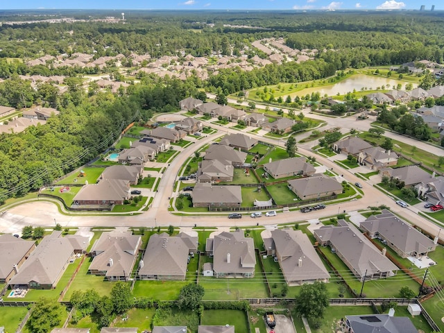 5015 Gold Lantana Trl, Spring, TX 77389 - aerial view of property and surrounding area with a forest, nearby suburban area, and a large body of water