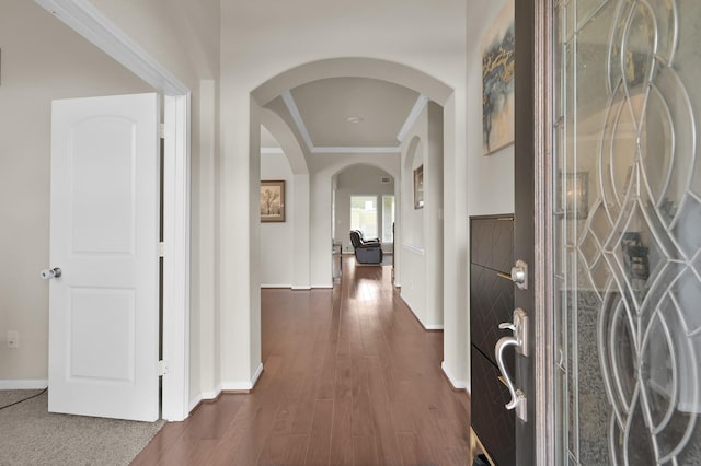 5015 Gold Lantana Trl, Spring, TX 77389 - entryway with arched walkways, crown molding, baseboards, and dark wood-style floors
