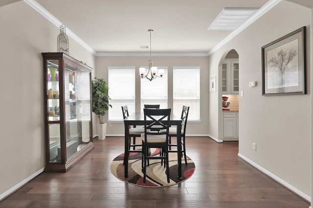 5015 Gold Lantana Trl, Spring, TX 77389 - dining room featuring a chandelier, dark wood-style flooring, crown molding, and baseboards