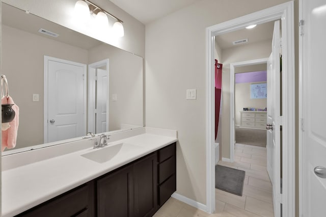5015 Gold Lantana Trl, Spring, TX 77389 - bathroom featuring vanity, tile patterned flooring, and baseboards