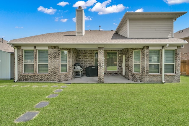 5015 Gold Lantana Trl, Spring, TX 77389 - rear view of property with brick siding, a patio area, a chimney, and a shingled roof