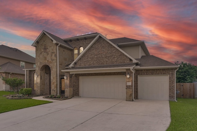 5015 Gold Lantana Trl, Spring, TX 77389 - view of front of property with an attached garage, driveway, brick siding, and stone siding