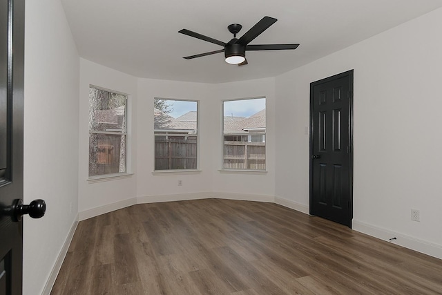 28511 Kevington Ct, Spring, TX 77386 - spare room with wood finished floors, a ceiling fan, and baseboards