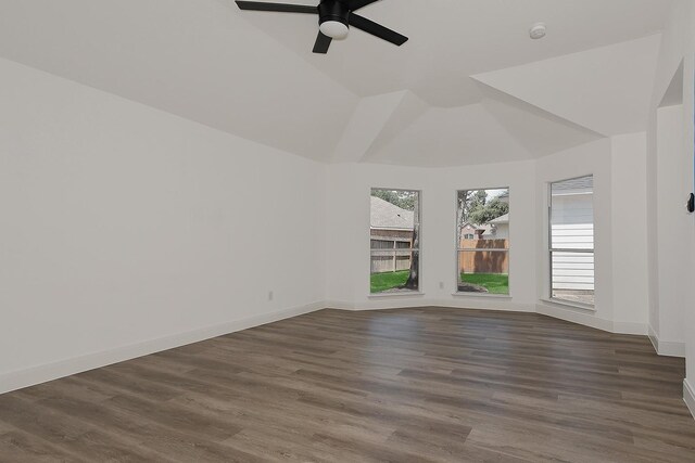 28511 Kevington Ct, Spring, TX 77386 - unfurnished room with ceiling fan, dark wood-style flooring, vaulted ceiling, baseboards, and a smoke detector