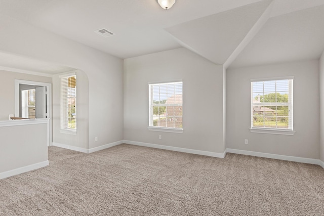 2131 Cranbrook Ridge Ln, Sugar Land, TX 77479 - empty room featuring healthy amount of natural light, light colored carpet, and lofted ceiling