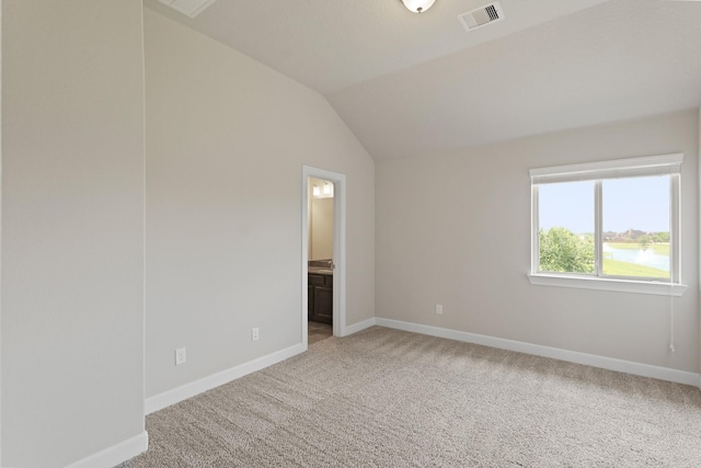 2131 Cranbrook Ridge Ln, Sugar Land, TX 77479 - unfurnished bedroom with light colored carpet, baseboards, vaulted ceiling, and ensuite bathroom