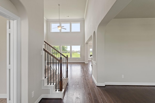 2131 Cranbrook Ridge Ln, Sugar Land, TX 77479 - entryway with arched walkways, healthy amount of natural light, ceiling fan, and baseboards