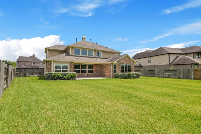 2131 Cranbrook Ridge Ln, Sugar Land, TX 77479 - back of property with brick siding, a patio, and a shingled roof